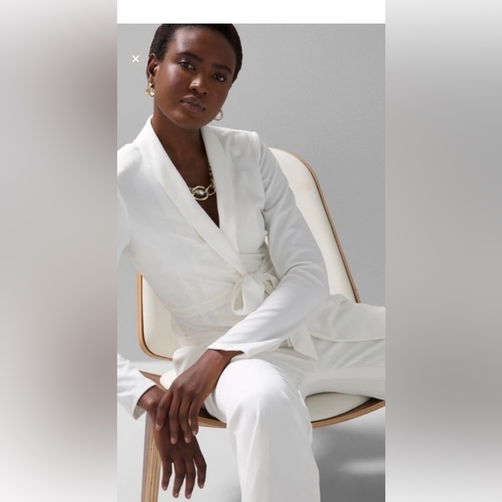 Black house, white market, white stretch, suit, pants, and suit jacket